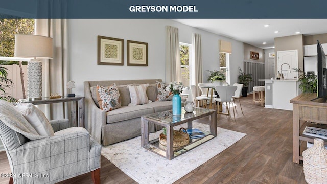 living room featuring dark wood-style floors and recessed lighting