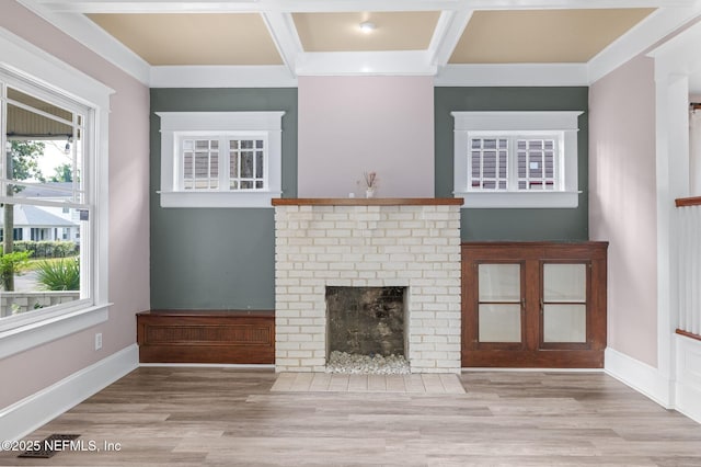 unfurnished living room featuring baseboards, wood finished floors, and a fireplace