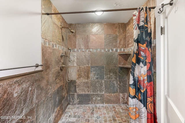 full bathroom featuring tiled shower