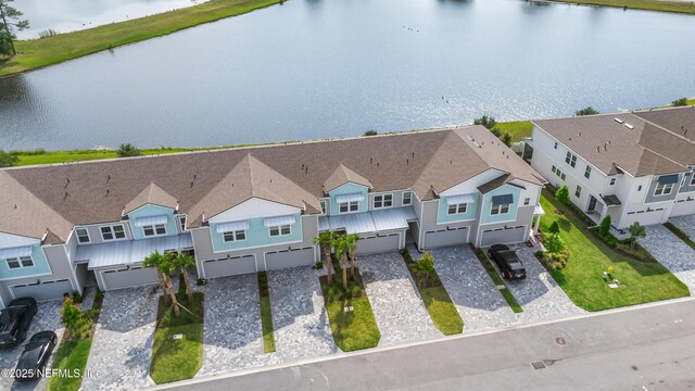 aerial perspective of suburban area featuring a large body of water