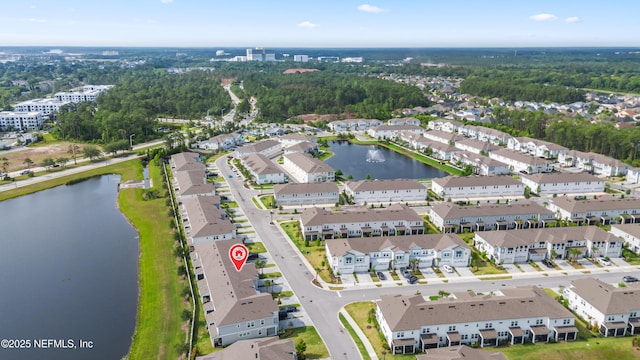 aerial view of property's location with a nearby body of water