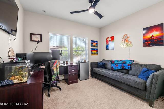 office area with light colored carpet and a ceiling fan