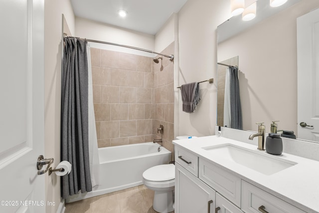 bathroom featuring toilet, shower / bath combo, vanity, and tile patterned flooring