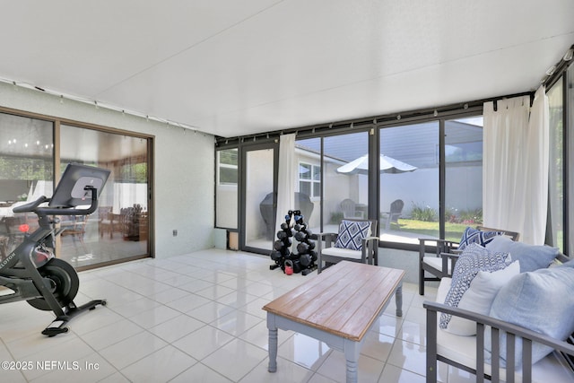 sunroom featuring tile patterned flooring
