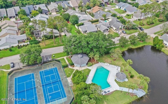 bird's eye view with a water view and a residential view