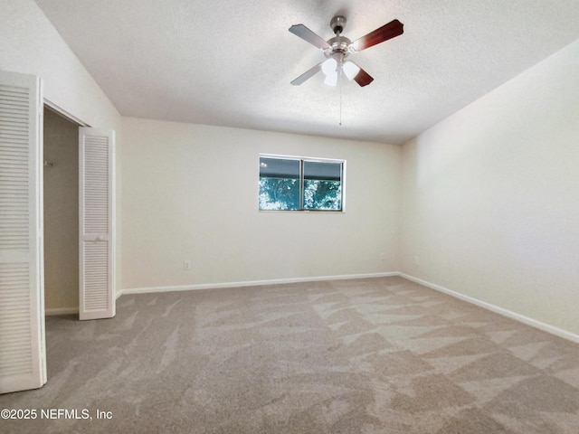 3801 Crown Point Rd Unit 1311, Jacksonville, FL 32257 - unfurnished bedroom featuring carpet, a closet, baseboards, and a textured ceiling