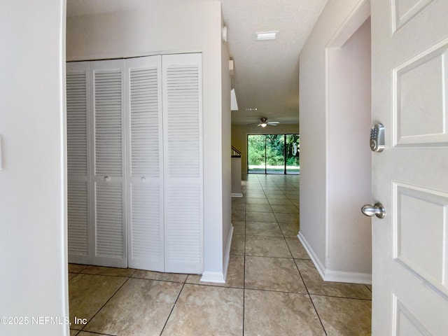 3801 Crown Point Rd Unit 1311, Jacksonville, FL 32257 - corridor with baseboards and tile patterned flooring