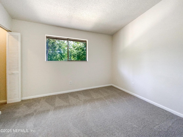 3801 Crown Point Rd Unit 1311, Jacksonville, FL 32257 - carpeted empty room featuring baseboards and a textured ceiling