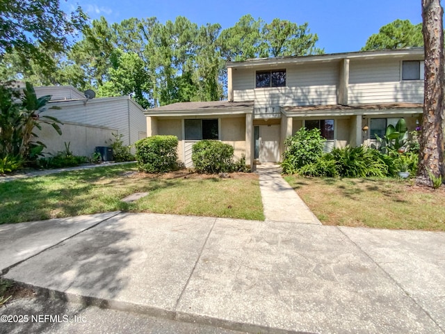 3801 Crown Point Rd Unit 1311, Jacksonville, FL 32257 - view of front of property with a front yard and stucco siding
