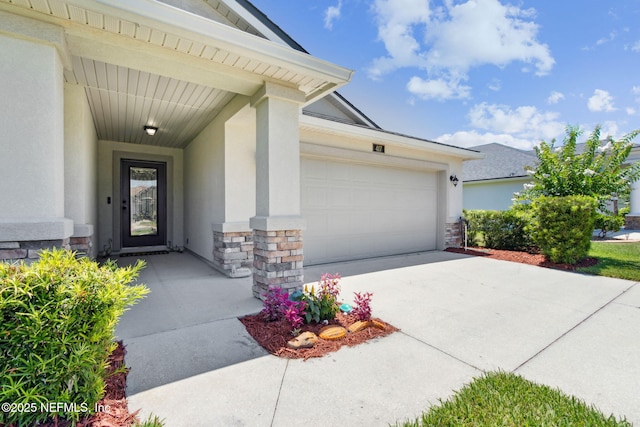 417 Palazzo Cir, Saint Augustine, FL 32092 - entrance to property with an attached garage, concrete driveway, stucco siding, and stone siding