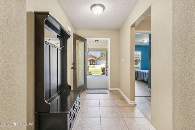 417 Palazzo Cir, Saint Augustine, FL 32092 - doorway to outside with a textured wall, a textured ceiling, and light tile patterned floors
