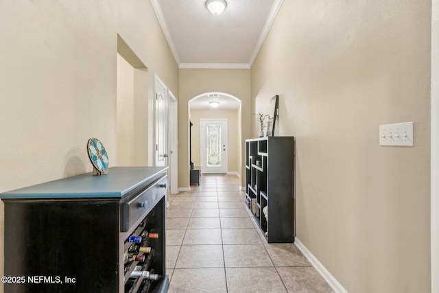 417 Palazzo Cir, Saint Augustine, FL 32092 - corridor featuring arched walkways, light tile patterned floors, and ornamental molding