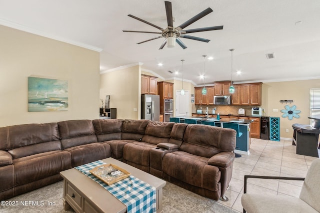 417 Palazzo Cir, Saint Augustine, FL 32092 - living room with a ceiling fan, ornamental molding, recessed lighting, vaulted ceiling, and light tile patterned floors