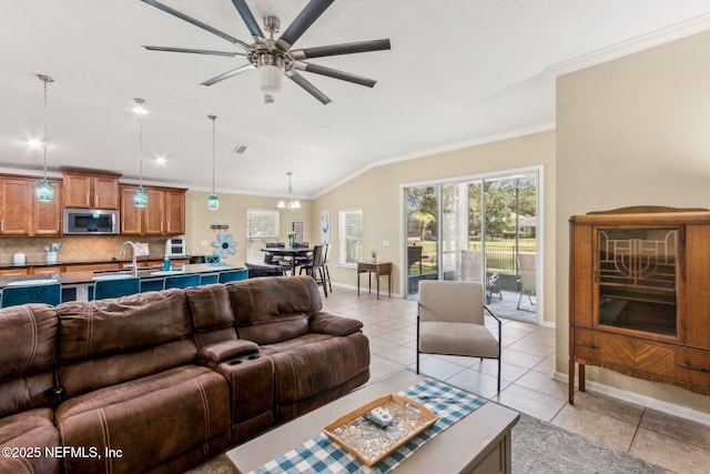 417 Palazzo Cir, Saint Augustine, FL 32092 - living area featuring ornamental molding, vaulted ceiling, a ceiling fan, and light tile patterned floors