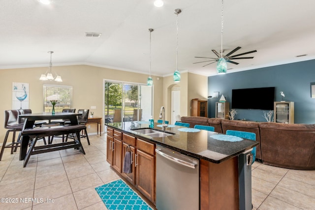 417 Palazzo Cir, Saint Augustine, FL 32092 - kitchen featuring dishwasher, a ceiling fan, dark stone countertops, brown cabinets, and hanging light fixtures