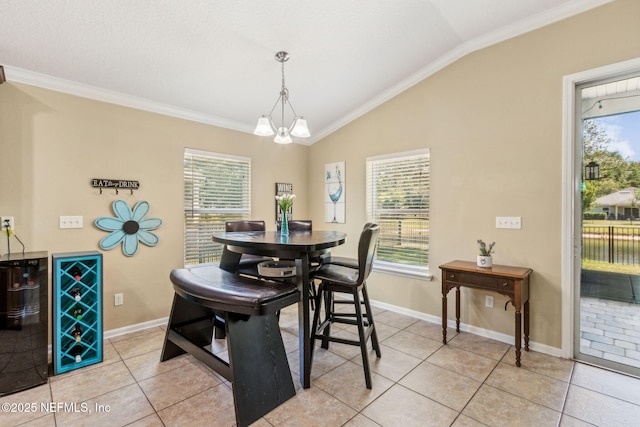 417 Palazzo Cir, Saint Augustine, FL 32092 - dining area with light tile patterned floors, lofted ceiling, crown molding, plenty of natural light, and a chandelier