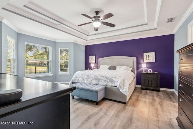 417 Palazzo Cir, Saint Augustine, FL 32092 - bedroom with a tray ceiling, light wood-style floors, ornamental molding, and ceiling fan