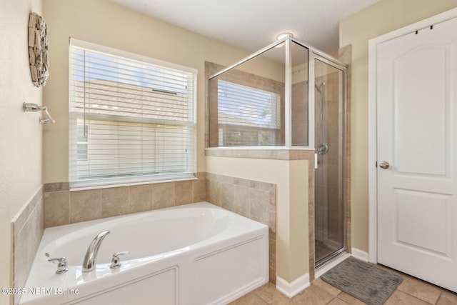 417 Palazzo Cir, Saint Augustine, FL 32092 - bathroom with a garden tub, a shower stall, and tile patterned floors
