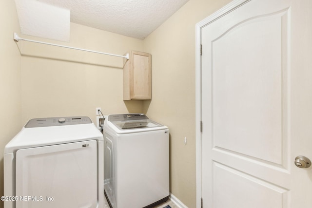 417 Palazzo Cir, Saint Augustine, FL 32092 - washroom featuring cabinet space, washer and clothes dryer, and a textured ceiling