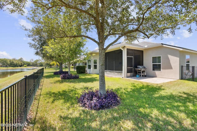 417 Palazzo Cir, Saint Augustine, FL 32092 - fenced backyard with a sunroom, a water view, and a patio area