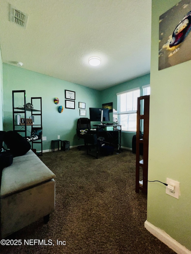 office space with carpet floors, visible vents, and baseboards