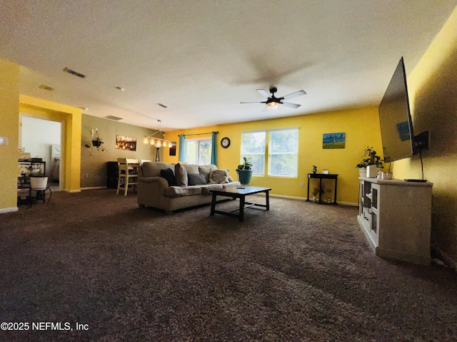 living room featuring carpet flooring, ceiling fan, and baseboards