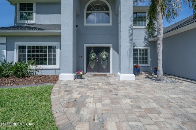 doorway to property with stucco siding