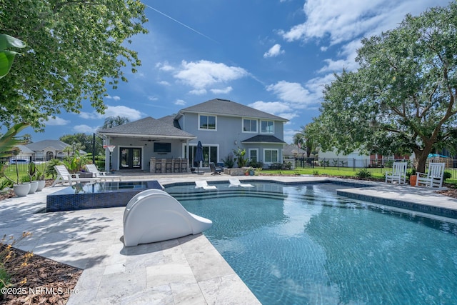 view of swimming pool with a patio, a fenced in pool, french doors, and fence