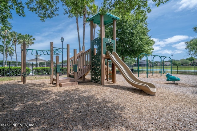 communal playground featuring fence
