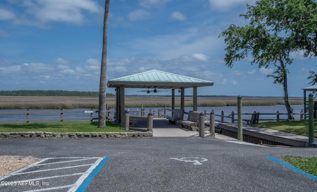 exterior space featuring a gazebo and a water view