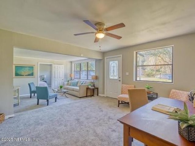 9717 Carbondale Dr W, Jacksonville, FL 32208 - living room with baseboards, ceiling fan, and carpet