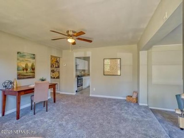 9717 Carbondale Dr W, Jacksonville, FL 32208 - home office featuring a ceiling fan, carpet flooring, and baseboards