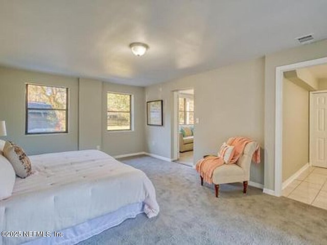 9717 Carbondale Dr W, Jacksonville, FL 32208 - carpeted bedroom with visible vents and baseboards
