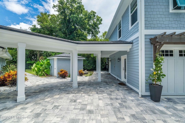 1246 Neck Rd, Ponte Vedra Beach, FL 32082 - view of patio / terrace featuring a storage shed, an outbuilding, and driveway