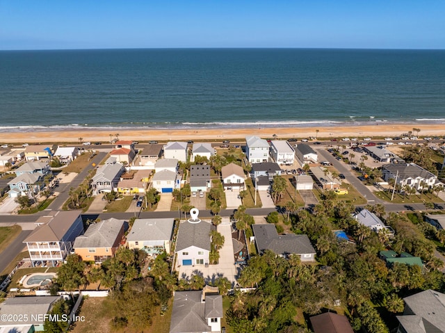 bird's eye view with a beach view, a residential view, and a water view