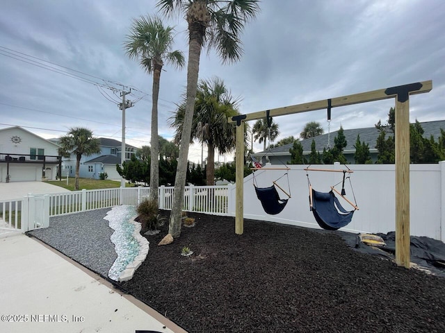 view of community with fence