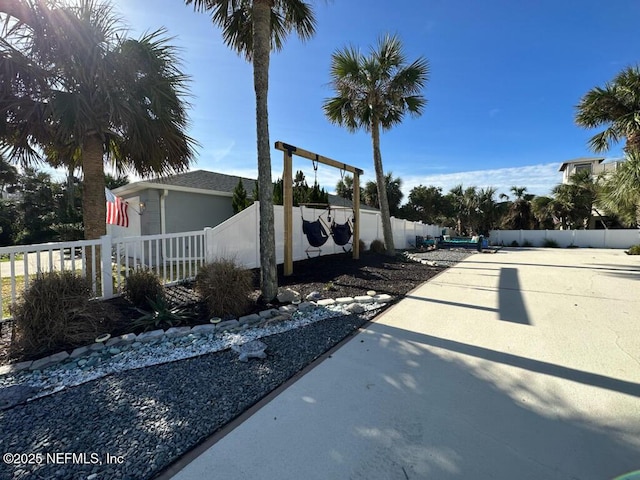 view of side of property with fence