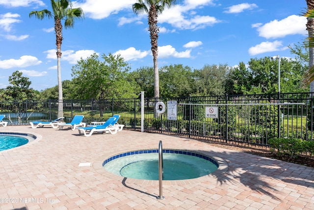 4958 Key Lime Dr Unit 106, Jacksonville, FL 32256 - view of swimming pool with a pool, fence, a hot tub, and a patio area