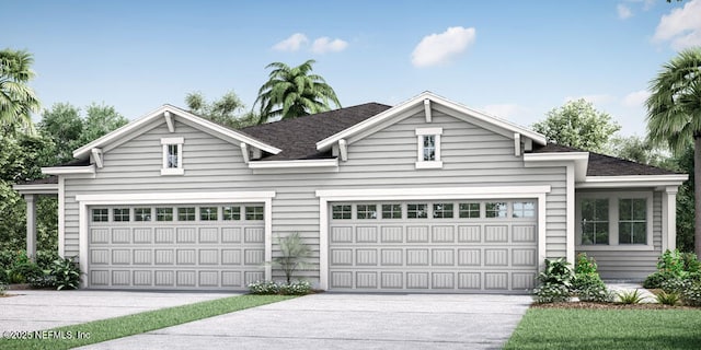 view of front of house with concrete driveway and an attached garage