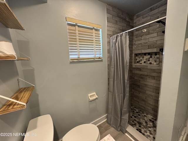 6070 Baltimore Ave, Cocoa, FL 32927 - bathroom featuring toilet, a stall shower, baseboards, and wood finished floors