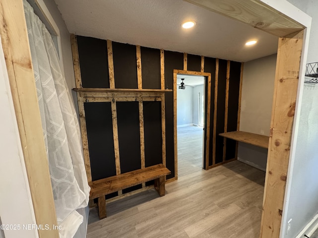 6070 Baltimore Ave, Cocoa, FL 32927 - mudroom featuring wood finished floors, wallpapered walls, and recessed lighting