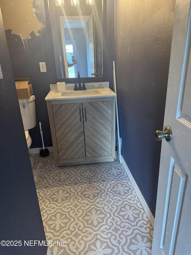 6070 Baltimore Ave, Cocoa, FL 32927 - half bath with toilet, vanity, and baseboards