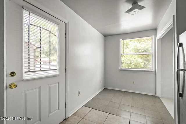 8384 Delaware Ave, Jacksonville, FL 32208 - unfurnished dining area featuring light tile patterned floors and baseboards