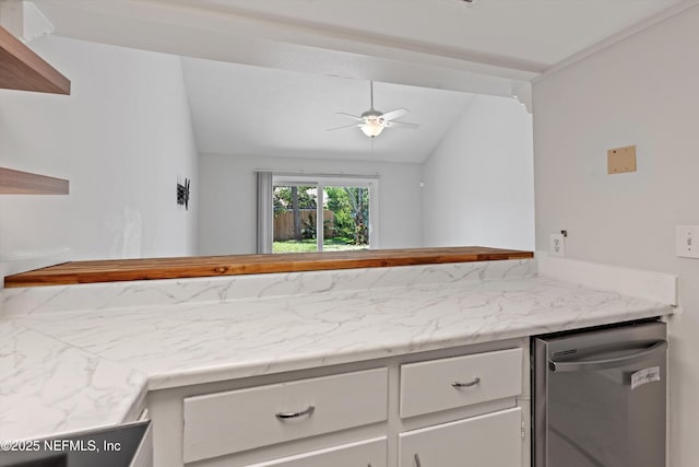 1616 1st St, Neptune Beach, FL 32266 - kitchen featuring dishwasher, vaulted ceiling, a ceiling fan, white cabinetry, and light countertops