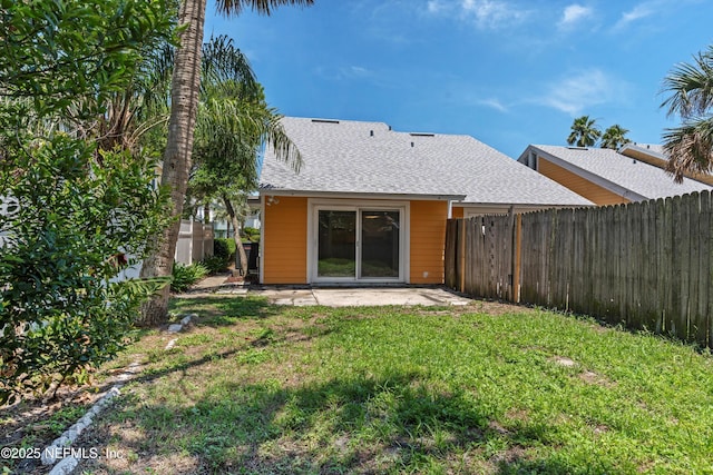 1616 1st St, Neptune Beach, FL 32266 - back of house featuring a shingled roof and a patio area