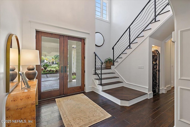 301 S Roscoe Blvd, Ponte Vedra Beach, FL 32082 - foyer entrance with french doors, stairs, a high ceiling, and hardwood / wood-style floors