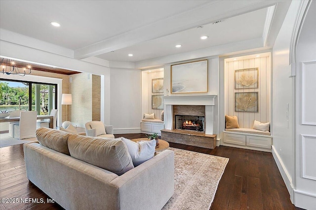 301 S Roscoe Blvd, Ponte Vedra Beach, FL 32082 - living area featuring baseboards, dark wood-style flooring, beam ceiling, and an inviting chandelier