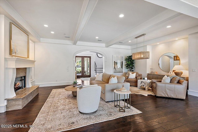 301 S Roscoe Blvd, Ponte Vedra Beach, FL 32082 - living room featuring baseboards, arched walkways, dark wood finished floors, and beamed ceiling