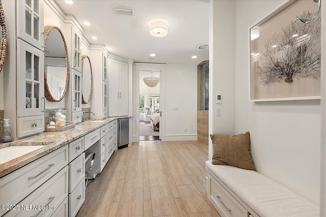 301 S Roscoe Blvd, Ponte Vedra Beach, FL 32082 - ensuite bathroom featuring double vanity, wood finished floors, a sink, ensuite bathroom, and recessed lighting