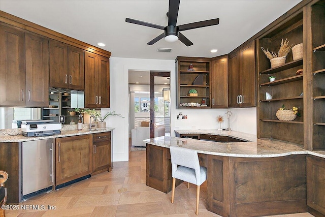 301 S Roscoe Blvd, Ponte Vedra Beach, FL 32082 - kitchen with visible vents, open shelves, dark brown cabinetry, light stone countertops, and ceiling fan